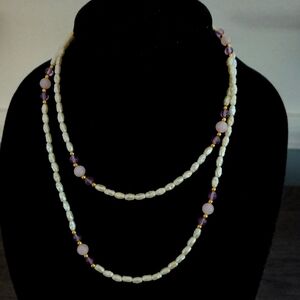 Purple and Cream Colored Beaded Necklace.